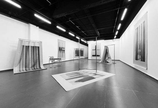 JOHN CORNU LES ÂMES GRISES, 2025 Metal structures, photographic prints on tarpaulin, modernist armchairs (based on Marcel Breuer's Wassily / B3 model) Variable dimensions Exhibition views "BAU", 27+, Hangzhou, China